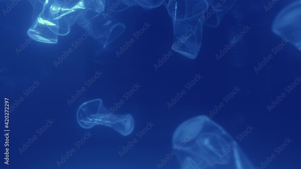 4K. 3840x2160p. Plastic is the cause of global warming. A lot of plastic is under water. Save earth save wold save live concept. 4K. 3840x2160p. Plastic is the cause of global warming. A lot of plastic is under water. Save earth save wold save live concept.