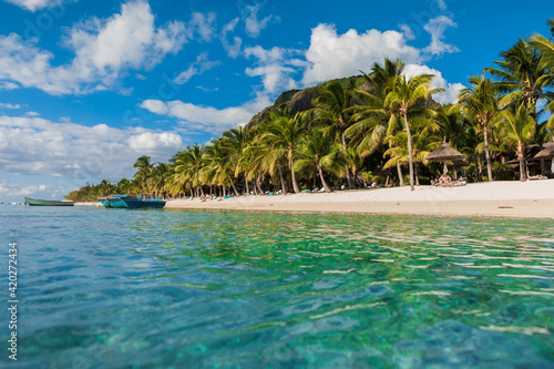 Fototapeta Naklejka Na Ścianę i Meble -  Beautiful view of the luxury beach in Mauritius. Ocean, white sand beach, palms and sky