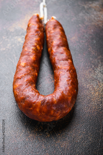 Traditional chorizo salami sausage on dark background
