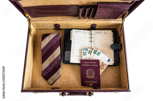 24 hour suitcase with passport, banknotes, chronograph, organizer and tie with cufflinks ready to go photo