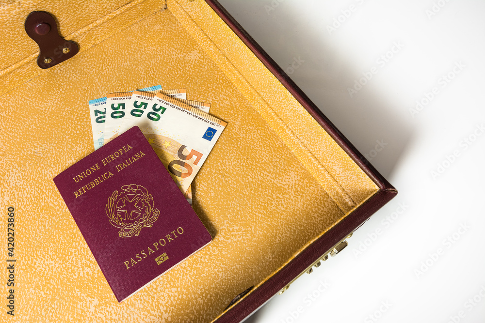 Obraz premium 24 hour suitcase with passport and banknotes