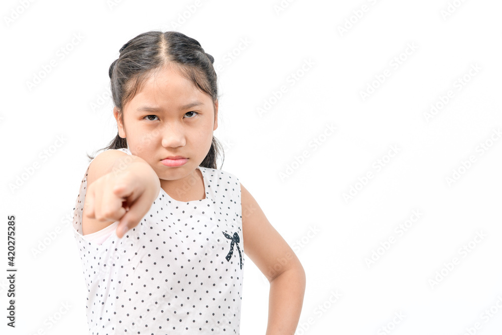 Portrait angry kid girl pointing finger at camera screaming isolated Portrait angry kid girl pointing finger at camera screaming isolated