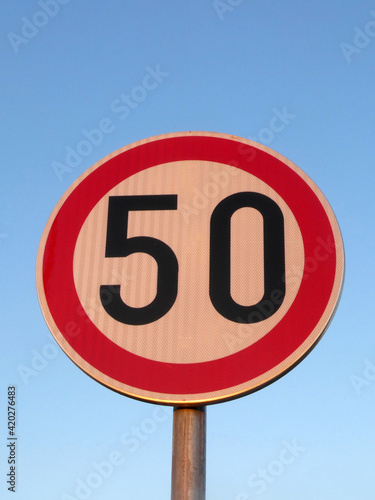Speed limit traffic sign indicating 50km/h