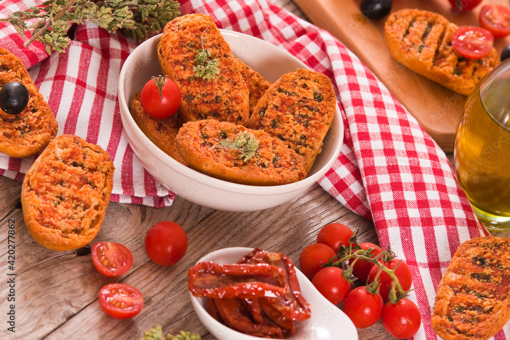 Toasted bread with tomato and oregano. 