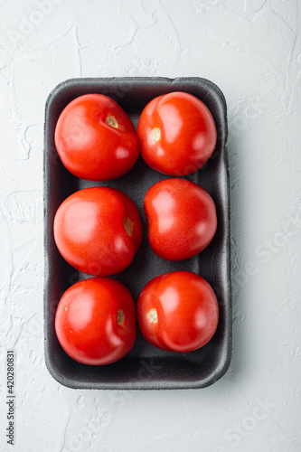 Fresh red organic tomatoe, on white background