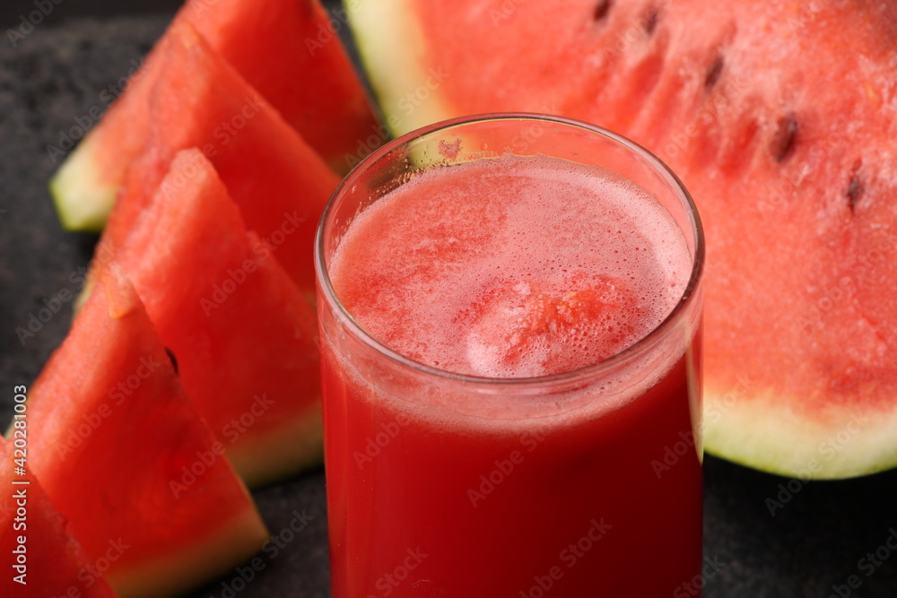 Watermelon smoothies or juice topping with fresh watermelon and mint leaves for summer drinks concept. Watermelon smoothies or juice topping with fresh watermelon and mint leaves for summer drinks concept.