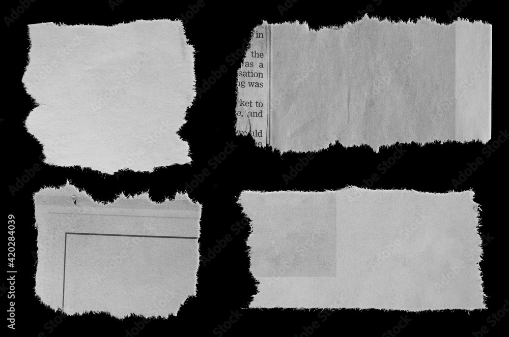 Torn papers on black