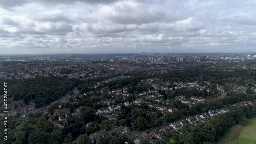 Aerial push in towards Leeds city above residential areas Aerial push in towards Leeds city above residential areas