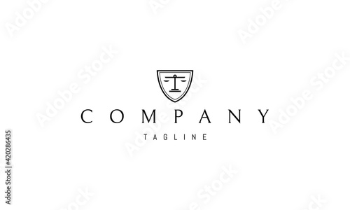 Vector logo on which an abstract image of a silhouette of a shield with scales of justice inside.