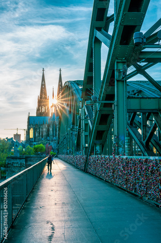 View from the Hohenzollern Bridge to Cologne Cathedral at sunset, Germany.
