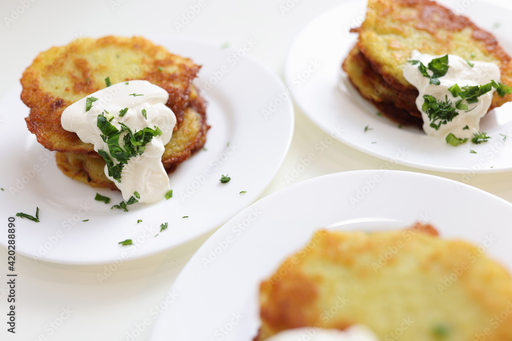 Potato pancakes with sour cream and herbs Potato pancakes with sour cream and herbs