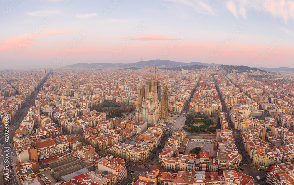 Aerial drone shot of Barcelona city center with Montjuic in early morning before sunrise in Spain winter dawn