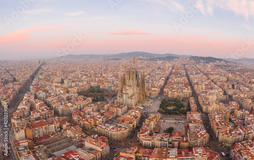Aerial drone shot of Barcelona city center with Montjuic in early morning before sunrise in Spain winter dawn