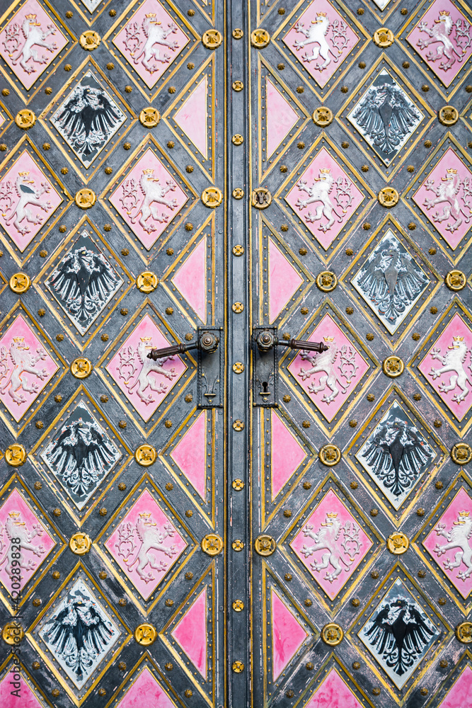 Prague, Czech republic - February 24, 2021. Detail of doors with eagle and lion - czech emblem of Basilica Minor in Vysehrad fortress area