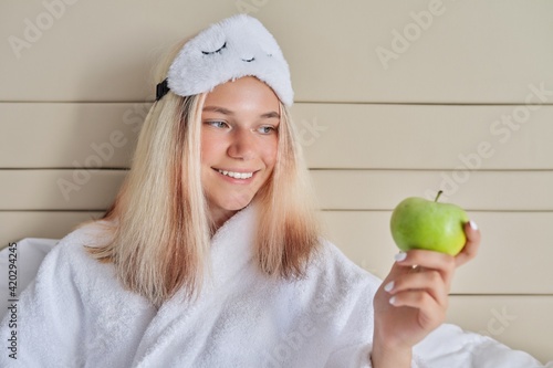 Wallpaper Mural Young woman in bed with green apple Torontodigital.ca