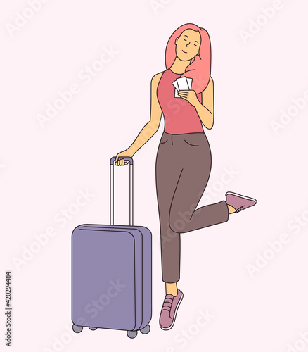 Vacation or business trip concept. Young smiling woman as traveller bring lugage bag. Travel abroad on vacation adventure lifestyle