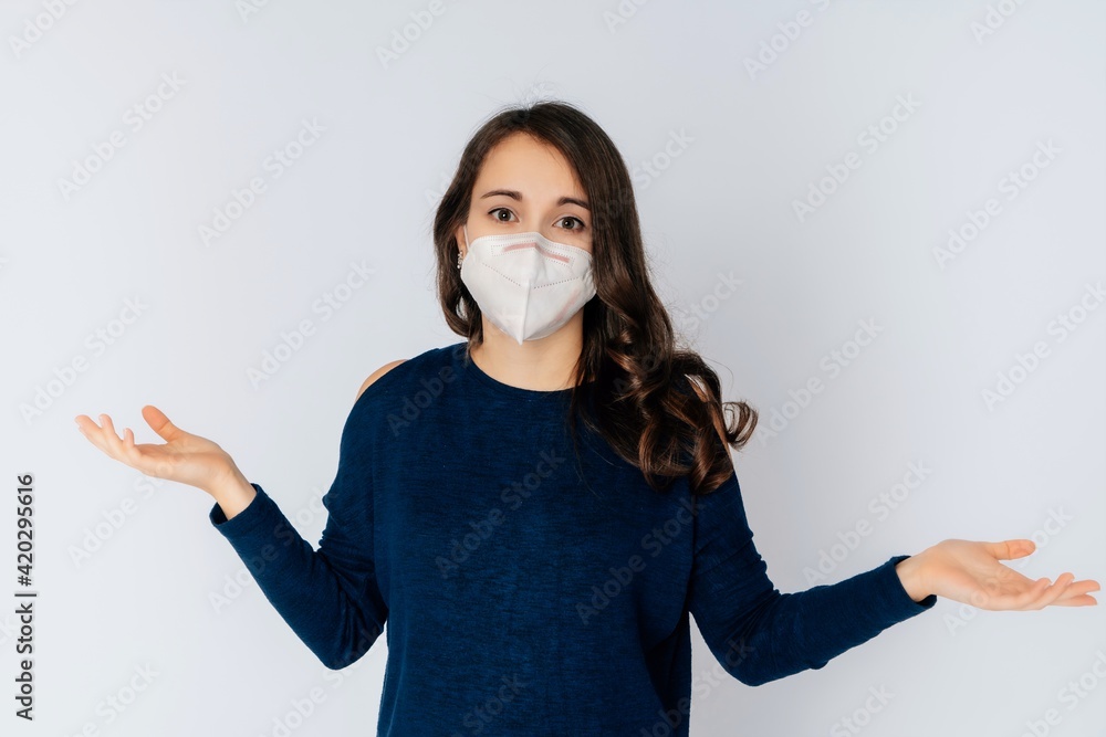 beautiful young woman wearing an anti viurs protection ffp2-mask to prevent from corona covid-19 and sars cov 2 infection white background copy space beautiful young woman wearing an anti viurs protection ffp2-mask to prevent from corona covid-19 and sars cov 2 infection white background copy space