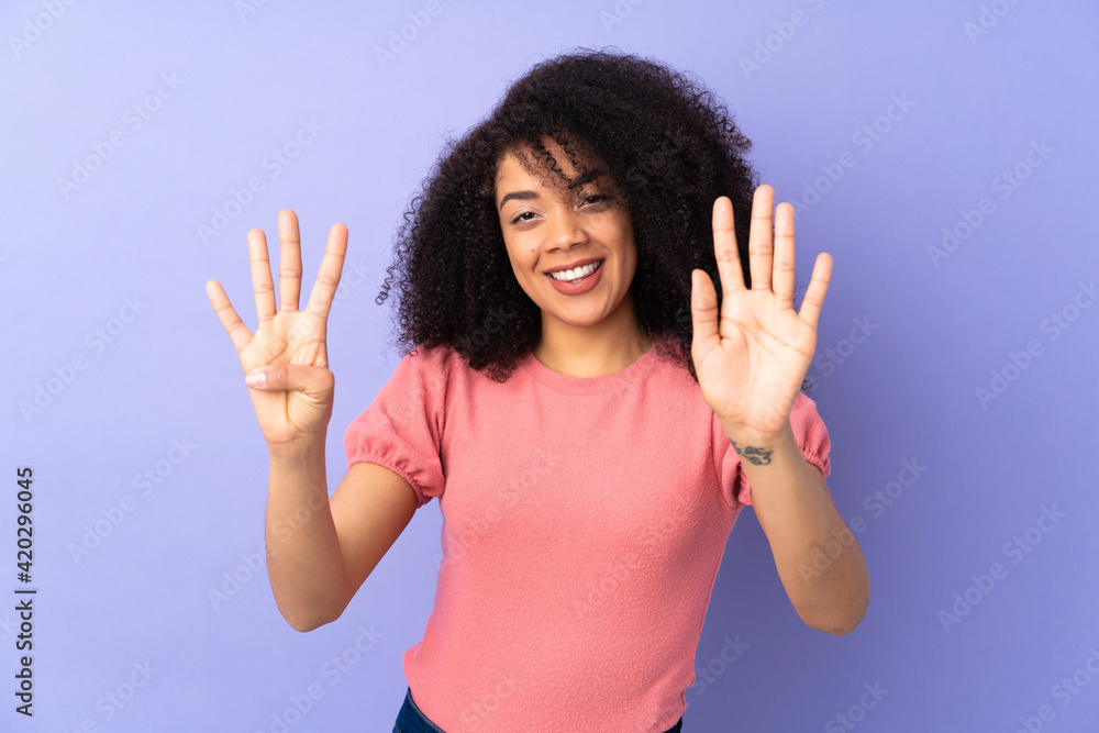 Young african american woman isolated on purple background counting nine with fingers Young african american woman isolated on purple background counting nine with fingers