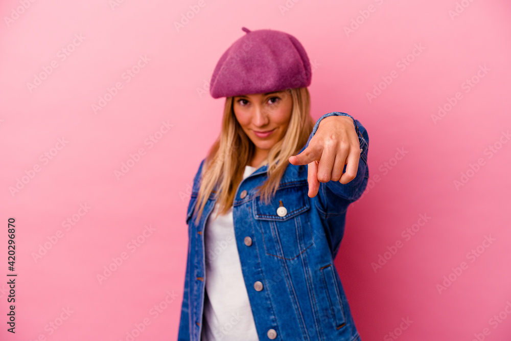 Young mixed race woman isolated on pink background cheerful smiles pointing to front. Young mixed race woman isolated on pink background cheerful smiles pointing to front.