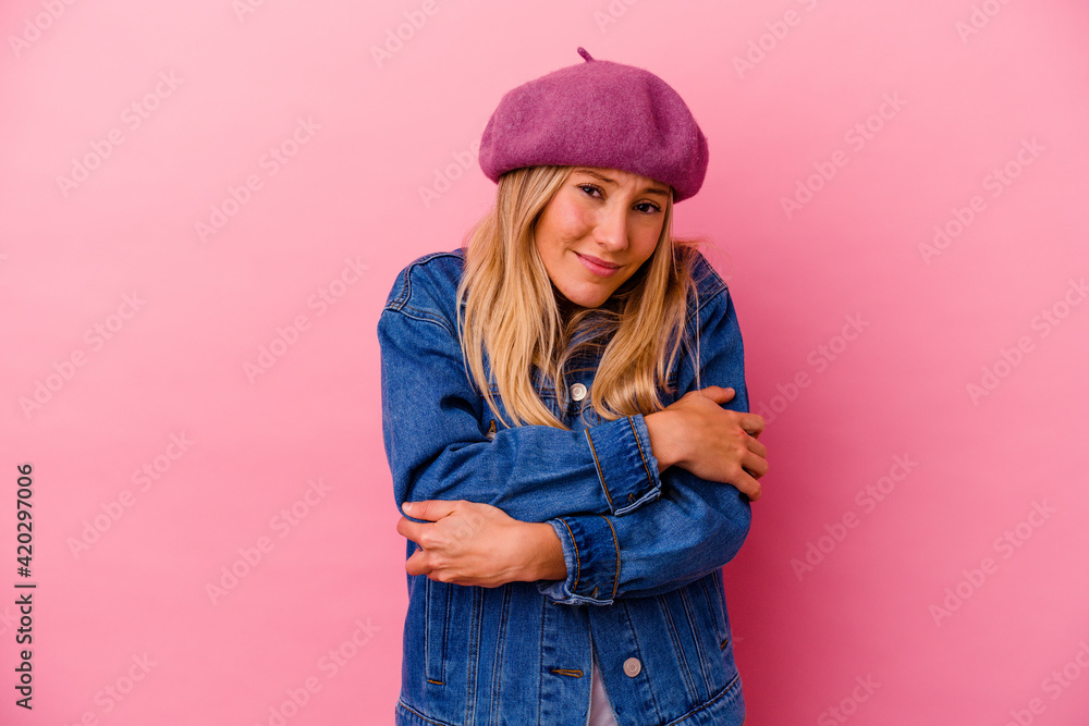 Young mixed race woman isolated on pink background suspicious, uncertain, examining you. Young mixed race woman isolated on pink background suspicious, uncertain, examining you.