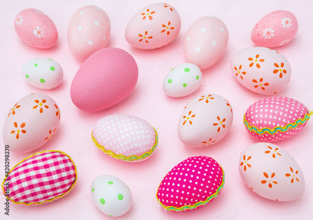 Happy Easter. Pink pastel color eggs variety on pink background