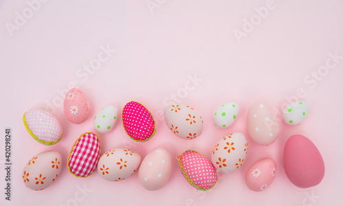Happy Easter. Pink pastel color eggs on pink background, copy space