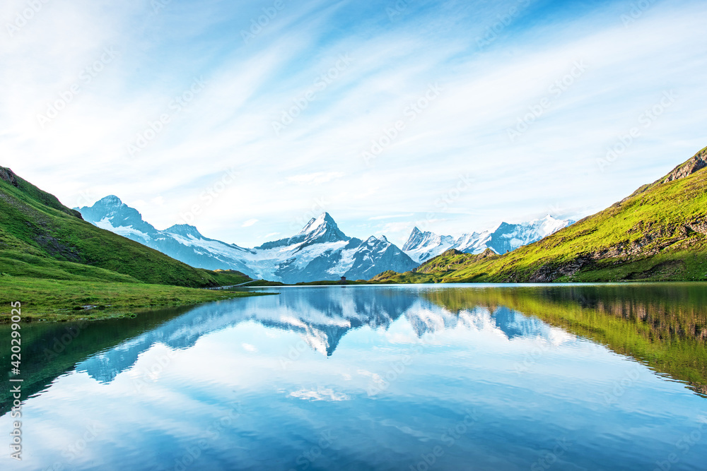 Fantastic landscape with the lake in the Swiss Alps. Wetterhorn, Schreckhorn, Finsteraarhorn et Bachsee. exotic places. magical scenes. (relaxation, harmony - concept).