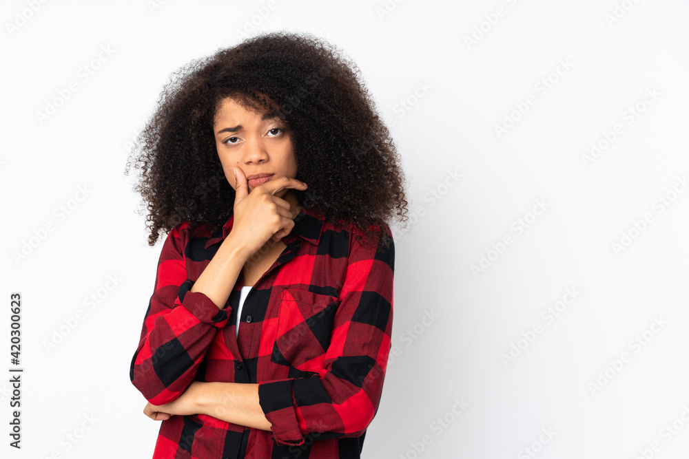 Young african american woman over isolated background having doubts Young african american woman over isolated background having doubts