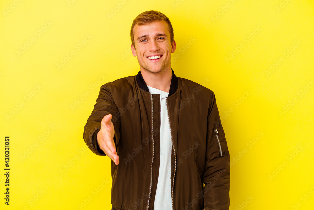 Young caucasian man isolated on yellow background Young caucasian man isolated on yellow background