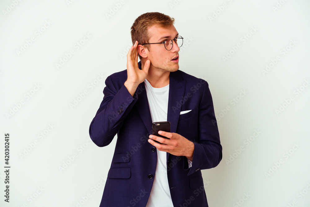 Young business man holding a phone isolated on white background Young business man holding a phone isolated on white background