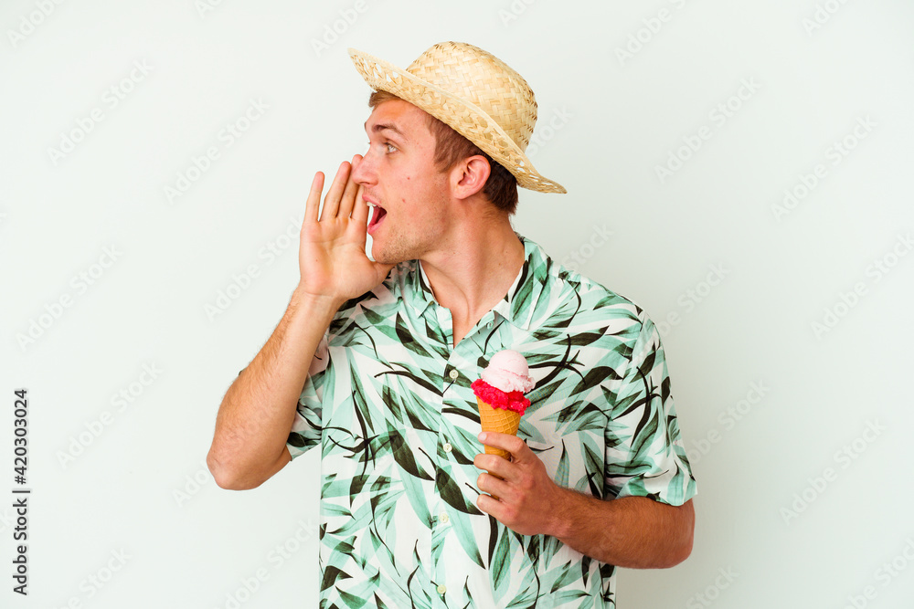 Young caucasian man wearing a summer clothes and holding a ice cream isolated on white background Young caucasian man wearing a summer clothes and holding a ice cream isolated on white background