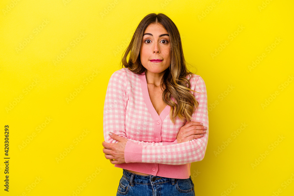 Young caucasian woman isolated on yellow background Young caucasian woman isolated on yellow background
