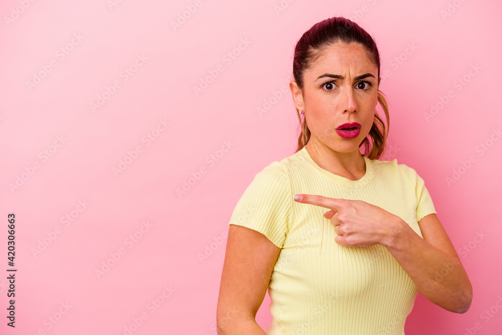 Young caucasian woman isolated on pink background Young caucasian woman isolated on pink background