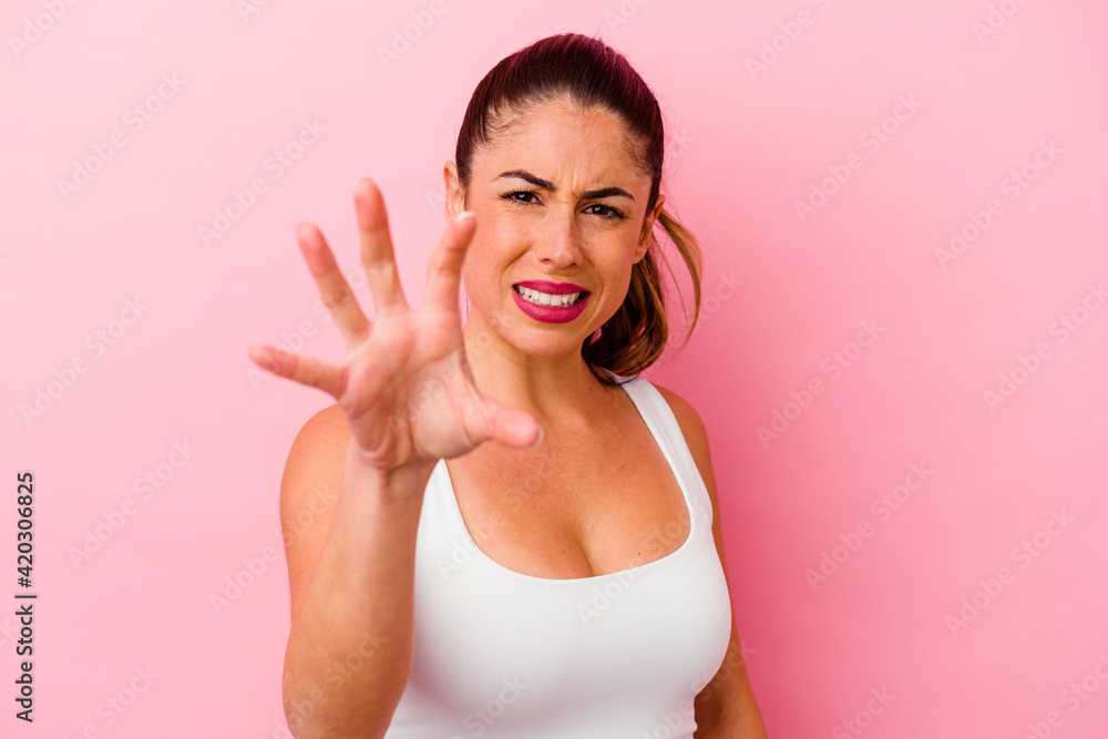 Young caucasian woman isolated on pink background Young caucasian woman isolated on pink background