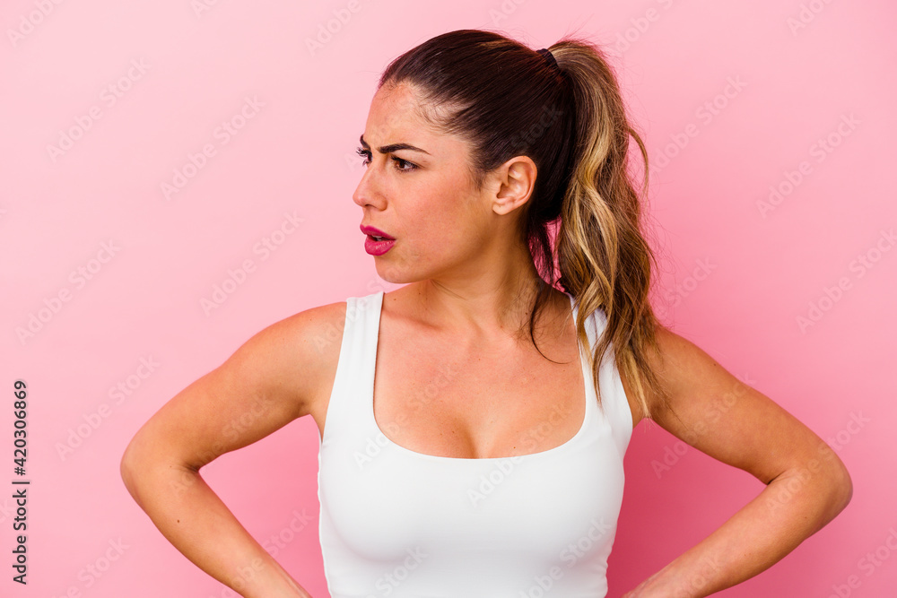 Young caucasian woman isolated on pink background Young caucasian woman isolated on pink background