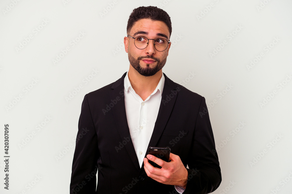 Young mixed race business man holding a mobile phone man isolated on white background Young mixed race business man holding a mobile phone man isolated on white background
