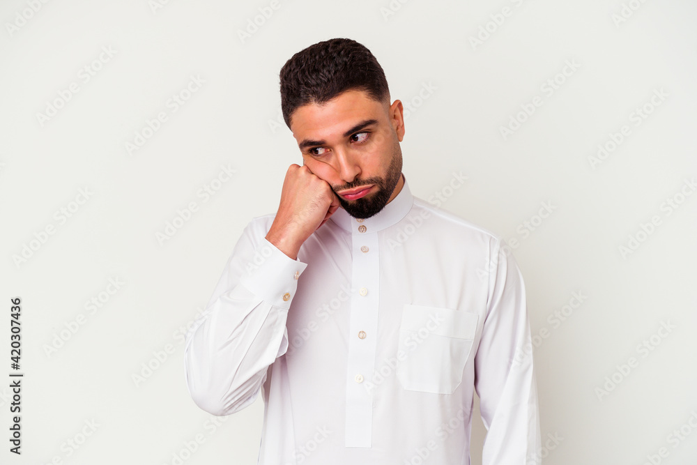 Young arab man wearing typical arab clothes isolated on white background Young arab man wearing typical arab clothes isolated on white background