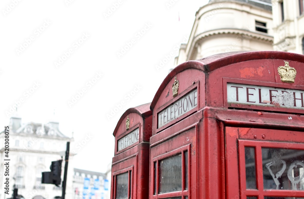 Traditional red phone booths in London streets Traditional red phone booths in London streets