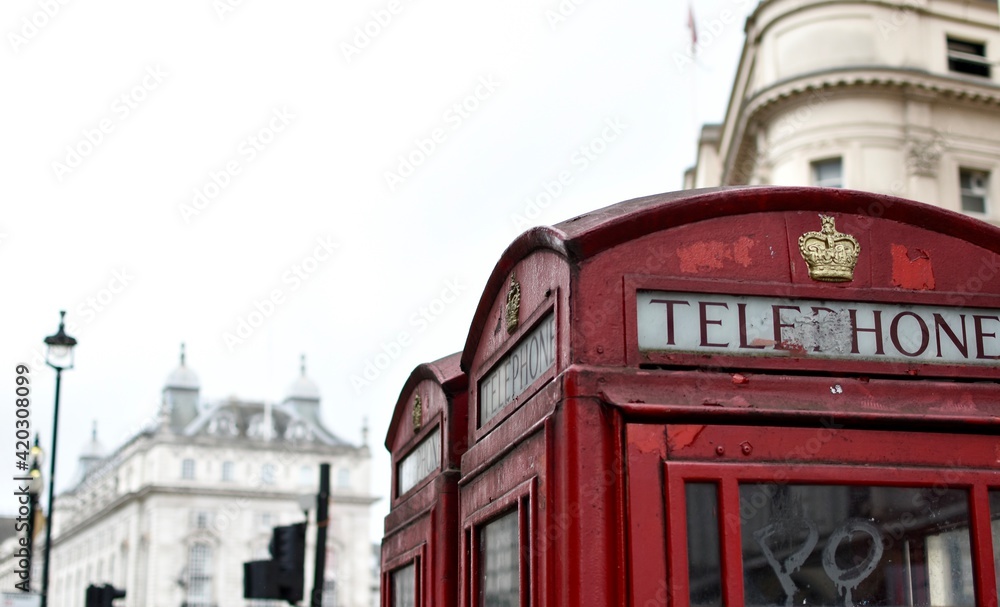 Traditional red phone booths in London streets Traditional red phone booths in London streets