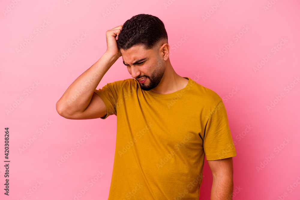 Young mixed race man isolated on pink background Young mixed race man isolated on pink background