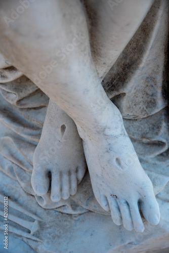 Christ's feet with stigmata in cemetery pieta © Mary Salen