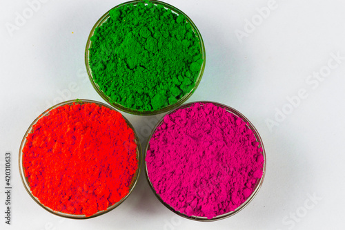 Top view of Colorful gulal Organic colour with white background for Indian Holi Festival. Happy Holi