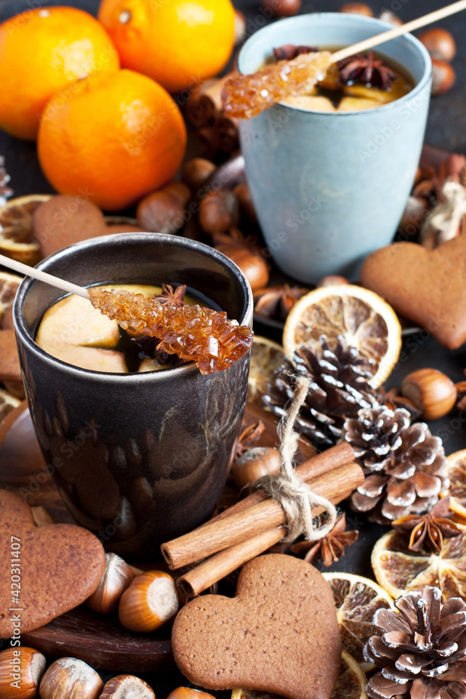 Cup of tea, apple, spices, nuts and cookies Cup of tea, apple, spices, nuts and cookies
