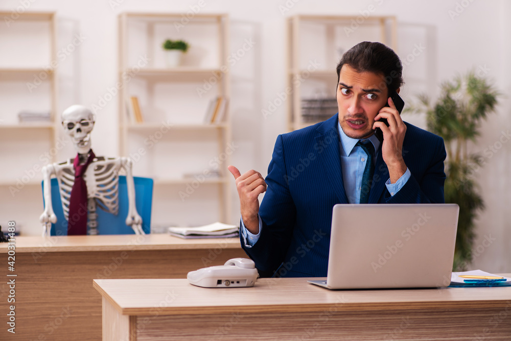 Dead employee working in the office Dead employee working in the office