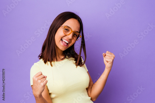 Young mixed race woman isolated cheering carefree and excited. Victory concept.