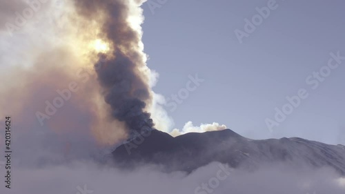 Aerial shooting with drone of the paroxysm of the Etna volcano by day 02 March 2021. Explosions, lava and column of smoke that covered the neighboring Etna villages with ash and lapilli.