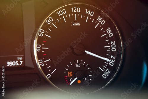 vehicle speed indicator showing excessive speed and low gas amount