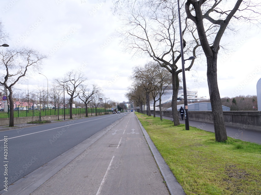 A avenue along the Philharmonic Opera of Paris. Avenue Jean Jaurès, Paris the 14th march 2021. A avenue along the Philharmonic Opera of Paris. Avenue Jean Jaurès, Paris the 14th march 2021.