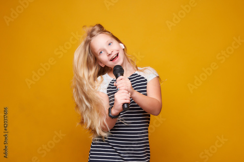 girl singing into microphone