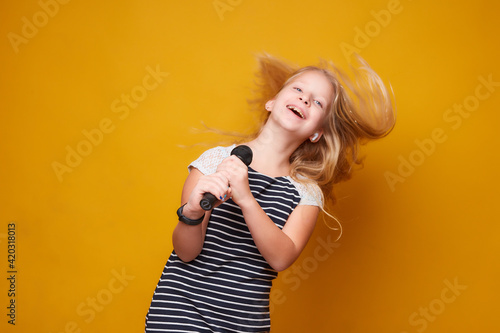 girl singing into microphone
